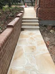 Many stone types are used to make crazy pave with porphyry, sandstone, quartz and slate being a few of the more noteworthy. Sandstone Crazy Paving Stone Tiles Wall Claddings Aussietecture Stone