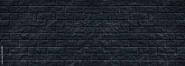 Wide Old Black Shabby Brick Wall