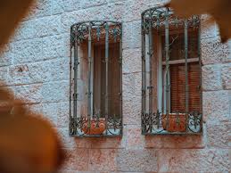 I love that the bars are on a hinge so they can be laid down against the wall if you need access to the window but lifted and secured when the window is not in use. Window Security Bars A Property Owner S Guide Crown Round Table