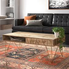 A glass coffee table makes for an elegant, subtle addition to the room, while a coffee table with storage is perfect for creating space for a striking centerpiece. Kirk Solid Wood Storage Coffee Table Reviews Allmodern