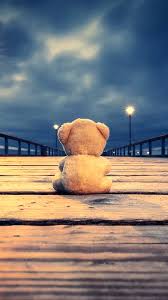 teddy bear on wooden bridge wallpaper