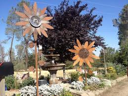 I loved these large metal flowers, but i didn't love the price so i made my own for a lot less with items from dollar tree and. Flower Girl Sculptures Add Appeal To Area Businesses Theunion Com