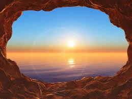 Free Photo | 3d view from a cave looking out to a sunset ocean