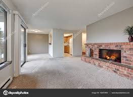 empty living room features grey walls