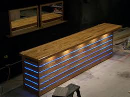 Use angle supports to anchor the top to the front of the pony wall. This Bar With A Few Curves In It And The Wood Of The Previous Bar Diy Outdoor Bar Diy Home Bar Basement Bar Plans