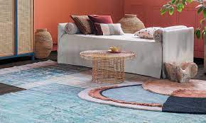 layering rugs is the new trend to make