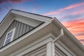 It can endure winds up to 110 mph or higher in addition to its strength, vinyl siding offers tremendous value and quality. White Frame Gutter Guard System With Gray Horizontal And Vertical Vinyl Siding Fascia Drip Edge Soffit On A Pitched Roof Attic At A Luxury American Single Family Home Dramatic Sunset Sky