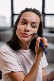 woman in white crew neck shirt holding