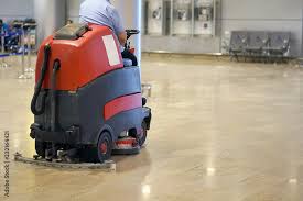 man driving professional floor cleaning