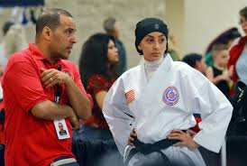 karate chion competes in a hijab