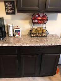 A muted green cabinet color adds depth and interest to the kitchen, while a butler sink and butcher block countertop adds a level of country chic. Wall Paint Color For Kitchen With Dark Cabinets Advice Needed