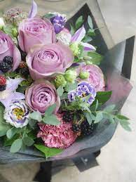 purple rose with green bouquet