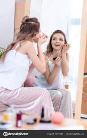 mirror applying makeup stock photo