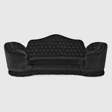 capitonné camelback sofa in black