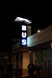 greyhound bus station sign at night