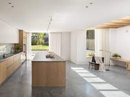 kitchen white cabinets concrete floors