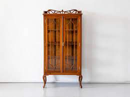 British Colonial Glass Front Cabinet