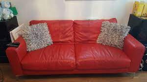 dfs red leather sofa village