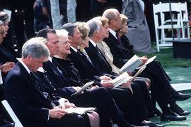 These events are described at the following link: George Hw Bush Funeral Four Presidents Sat Awkwardly On One Pew Bbc News