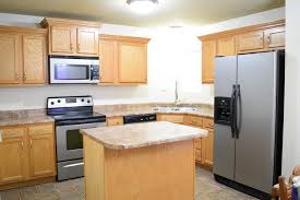 Ballard says you should refinish the cabinets already in your kitchen if the current design is updating hardware can also help make old cabinetry look new again. How To Refinish Wood Cabinets The Easy Way Love Remodeled
