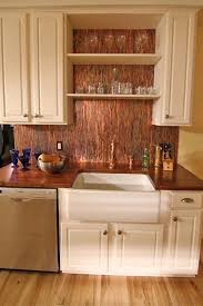 A copper tile backsplash is an easy to install choice. Heavy Copper Backsplash Sheets Copper Kitchen Backsplash Copper Kitchen Copper Backsplash