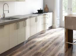 lay the floor or fit the kitchen first