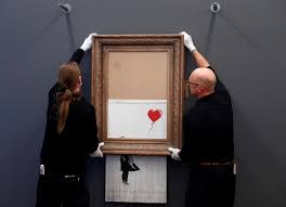 A print of the iconic 'girl with balloon' painting fro m 2006 went under the hammer at sotheby's auction house in london last friday. Self Shredding Banksy Painting Goes On Display In Germany