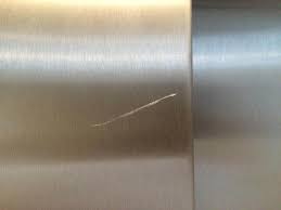 We test the durability of. Stainless Steel Lift Door Scratch Removal Bespoke Repairs