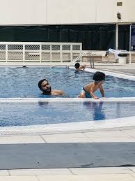 abu dhabi swimming coach khaled helal