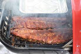barbecue ribs on a charcoal grill