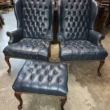 2 blue leather tufted wing back chairs