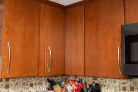 clean sticky wood kitchen cabinets