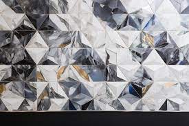 A Wall Of Silver Diamonds With A Black