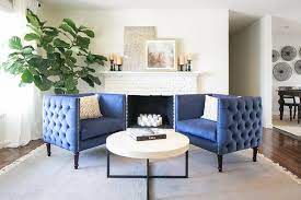 blue tufted accent chairs facing