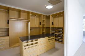 Center island provides drawer storage and hamper. 15 Amazing Walk In Closets For Your Home Wish List