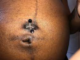 belly on piercing stretching and