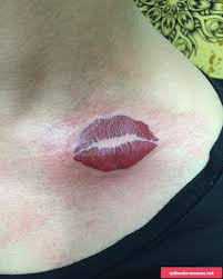 kiss print tattoo on neck