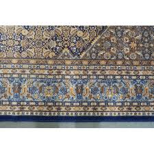 a blue and beige patterned ground prado