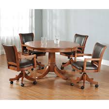 Other features include comfortable padded arms and caster wheels for ease of movement. Hillsdale Furniture Park View Brown Oak Game Table Four Game Chairs Bellacor