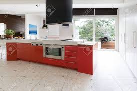 Kitchen cabinet stock photos and images (22,265). Orange Red Kitchen Cabinets In Island Bench In Modern Luxury Stock Photo Picture And Royalty Free Image Image 64885670