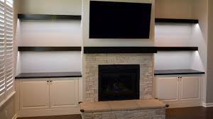 floating shelves and fireplace mantel