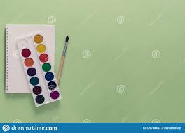 Top View Over A School Supplies As Paints Brush And Notebook From