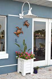 how to hang outdoor wall decor without