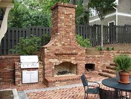 an outdoor fireplace with built in