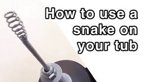 How to Unplug a Bathtub Drain Using a Snake or Drum Auger - YouTube