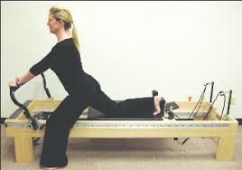 standing hip extension on the pilates