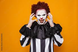 scary clown with red hair scream to