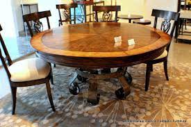 A circular dining table that expands when rotated. 15 Expandable Round Dining Table Modern Quality Teak