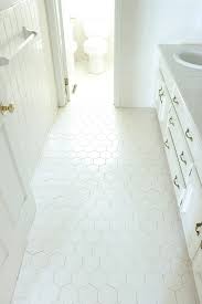 How to paint over tiles and install peel and stick flooring. How We Changed Our Bathroom Tile For 150 Bucks Noting Grace