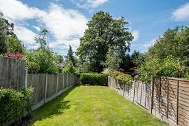 neighbour looks after garden fence